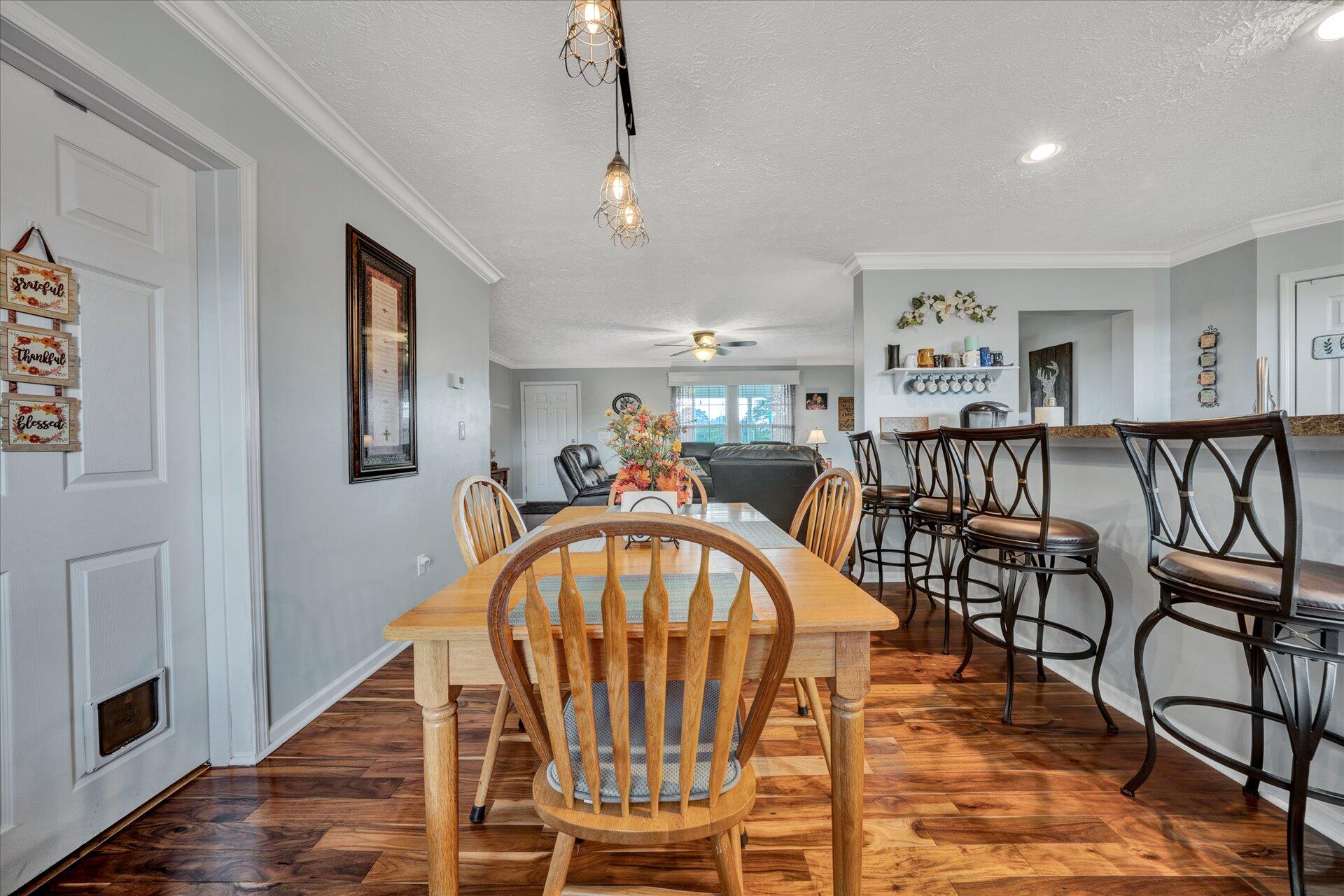 2220 Callaway Road Rocky Mount, VA 24151 - Photo 7 of 22 a view of a dining room with furniture and wooden floor