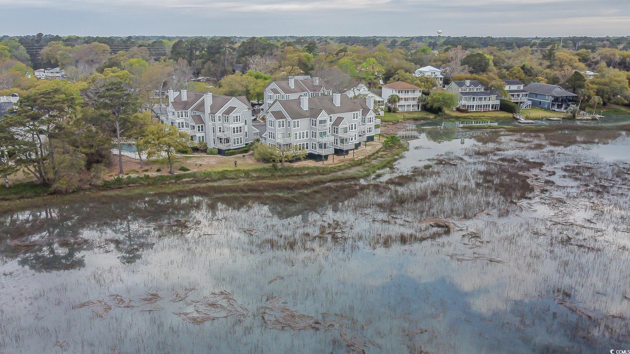 4999 Highway 17 Business, Unit 305 Murrells Inlet, SC 29576 - Photo 25 of 27 Aerial overview of property's location featuring nearby suburban area and a large body of water