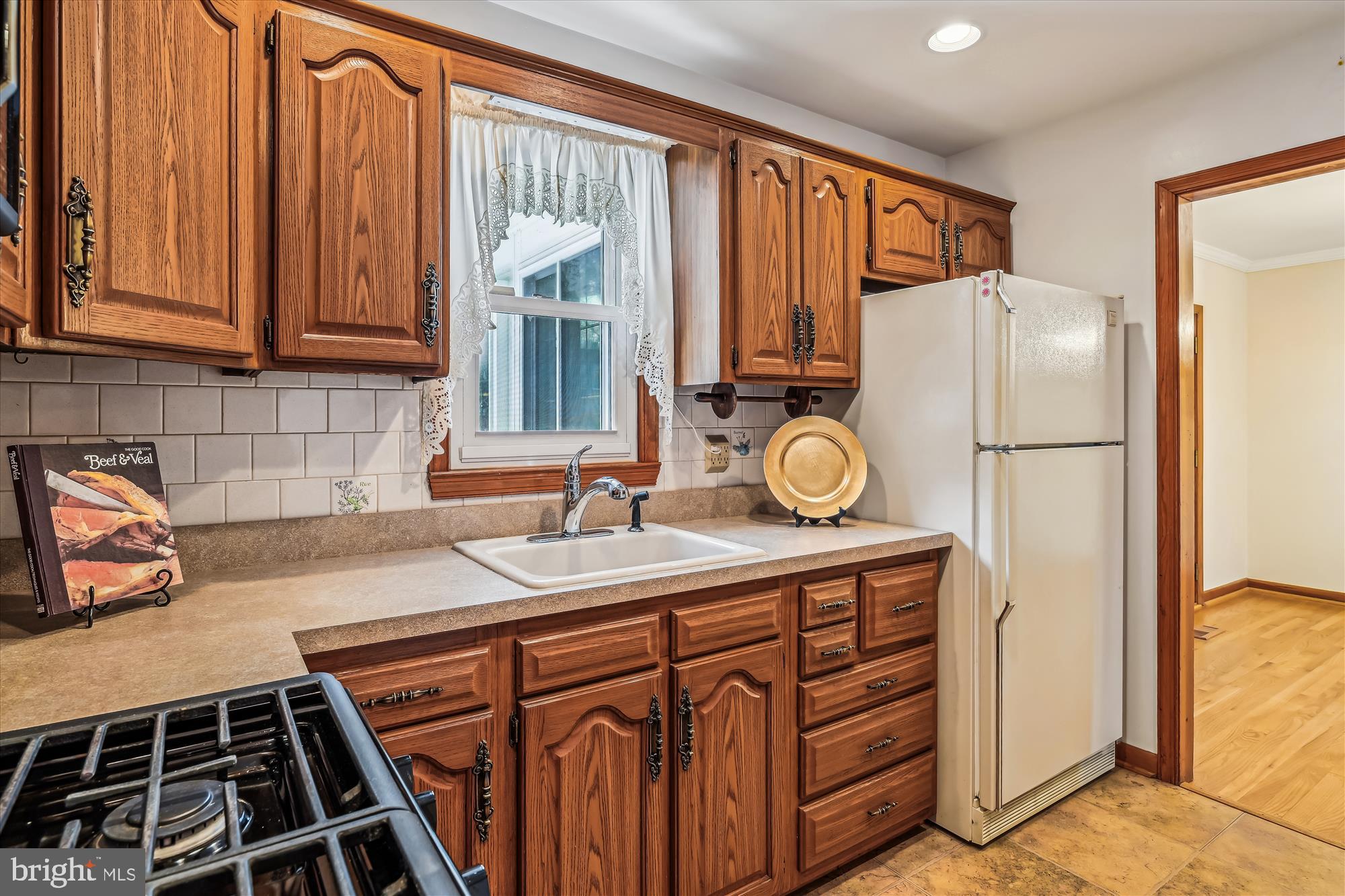 1418 Larch Road Severn, MD 21144 - Photo 15 of 36 a kitchen with stainless steel appliances granite countertop a refrigerator and a sink