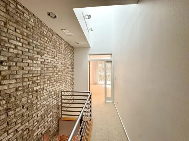 a bathroom with a shower and a sink