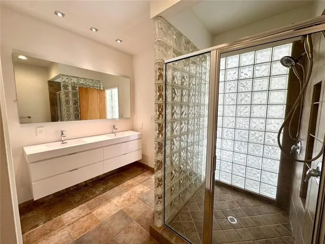 a view of a bedroom with washer and dryer