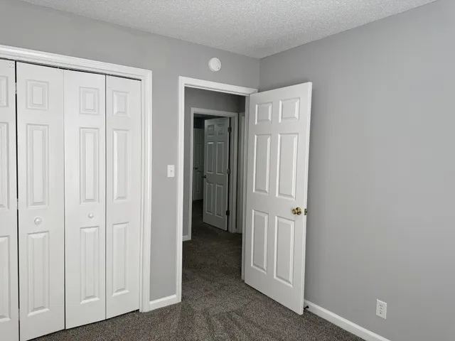 a white toilet sitting next to a bath tub