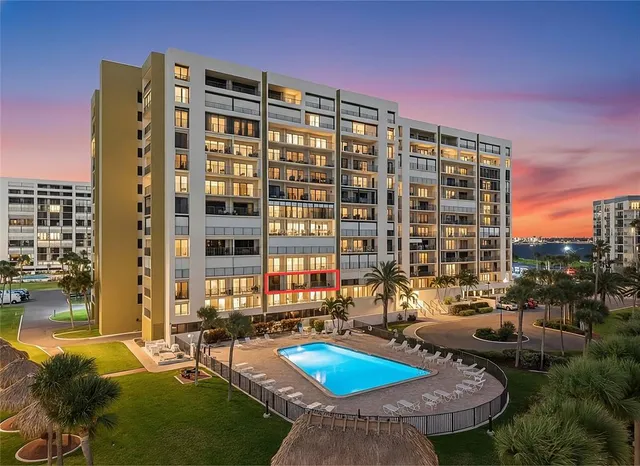 a front view of a building with outdoor seating