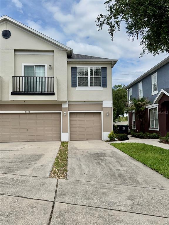6404 South Goldenrod Road, Unit 2A Orlando, FL 32822 - Photo 3 of 40 a front view of a house with a garden