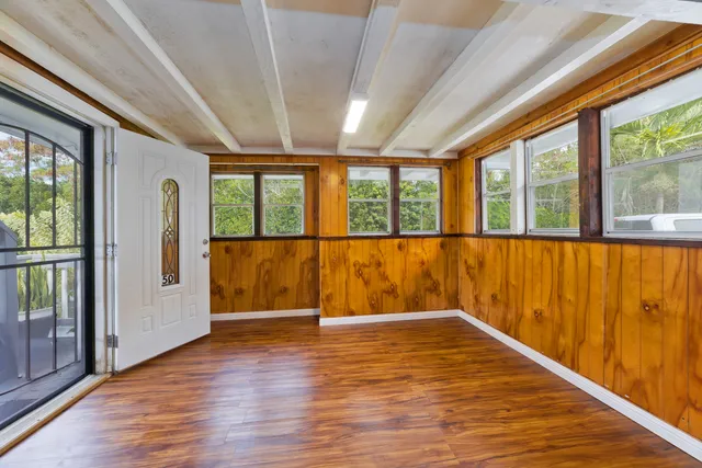 a bedroom with a bed and a lamp