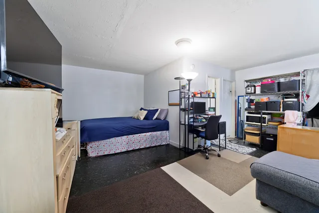 a bathroom with a sink vanity mirror and toilet