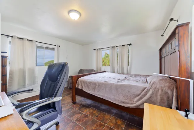 a bathroom with a toilet a sink and a mirror