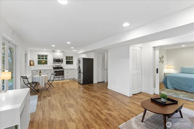 a kitchen with a stove a refrigerator and a sink
