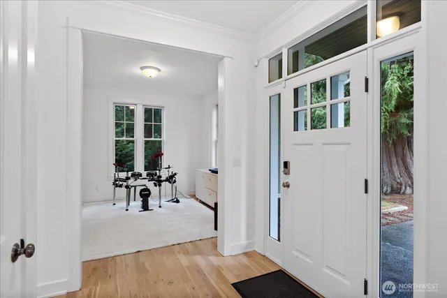 a view of dining room and hall with wooden floor