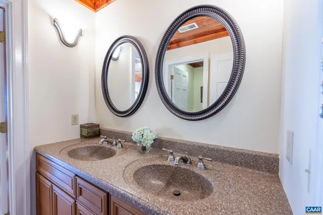 a view of a house with a yard patio and sitting area