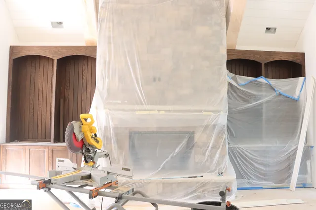 a view of a floor to ceiling window and wooden floor