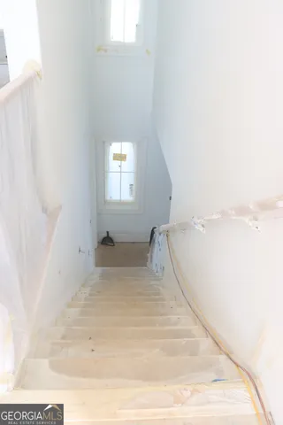 a view of a building with a door and a window