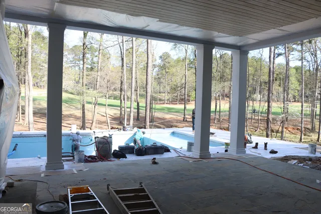 a view of outdoor space with signage and flags