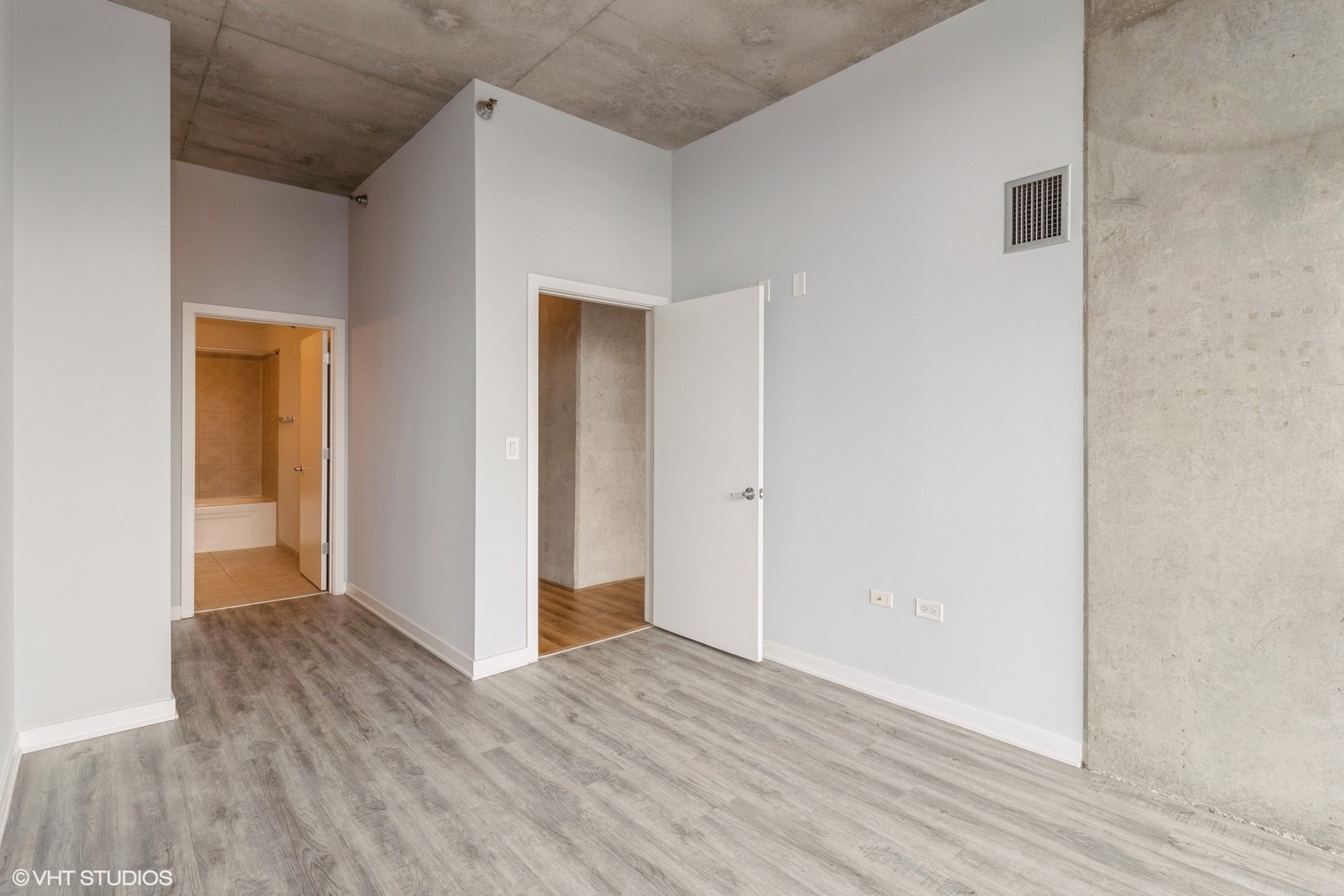 235 West Van Buren Street, Unit 2304 Chicago, IL 60607 - Photo 7 of 13 a view of hallway with wooden floor
