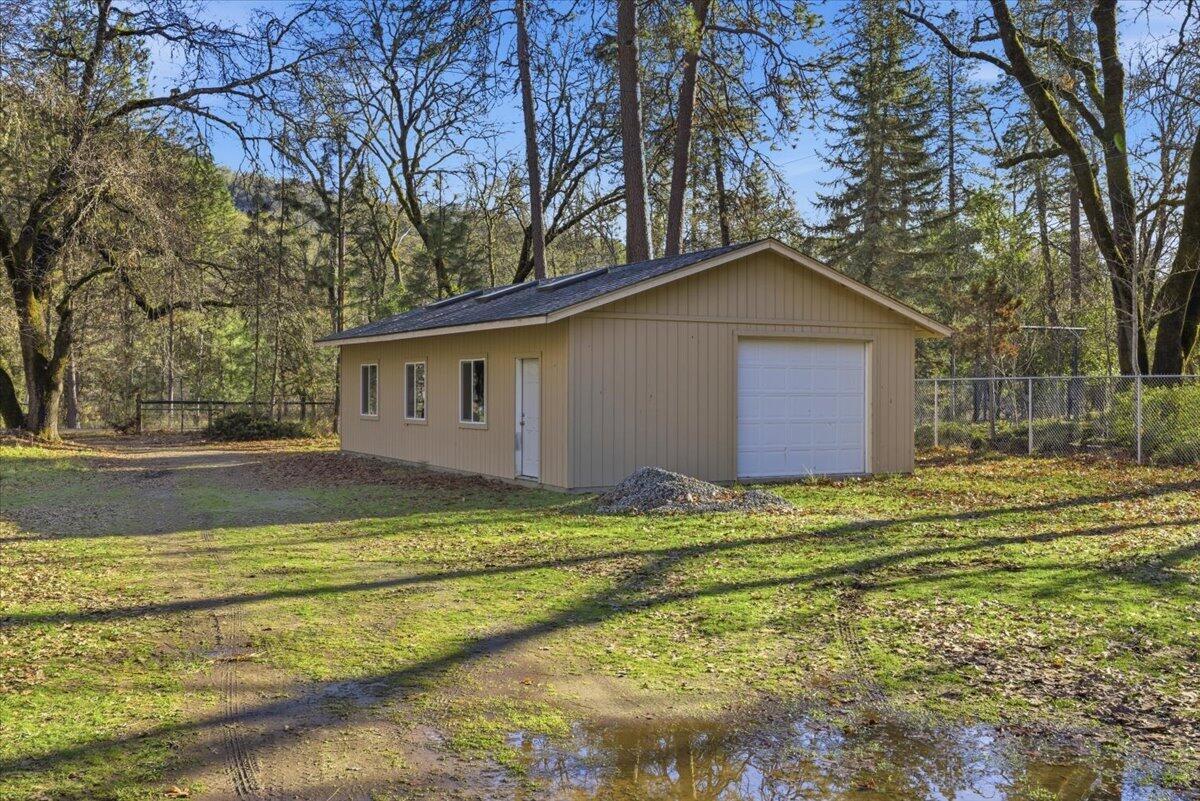 1401 Upper River Road Gold Hill, OR 97525 - Photo 6 of 8 a view of a house with a yard