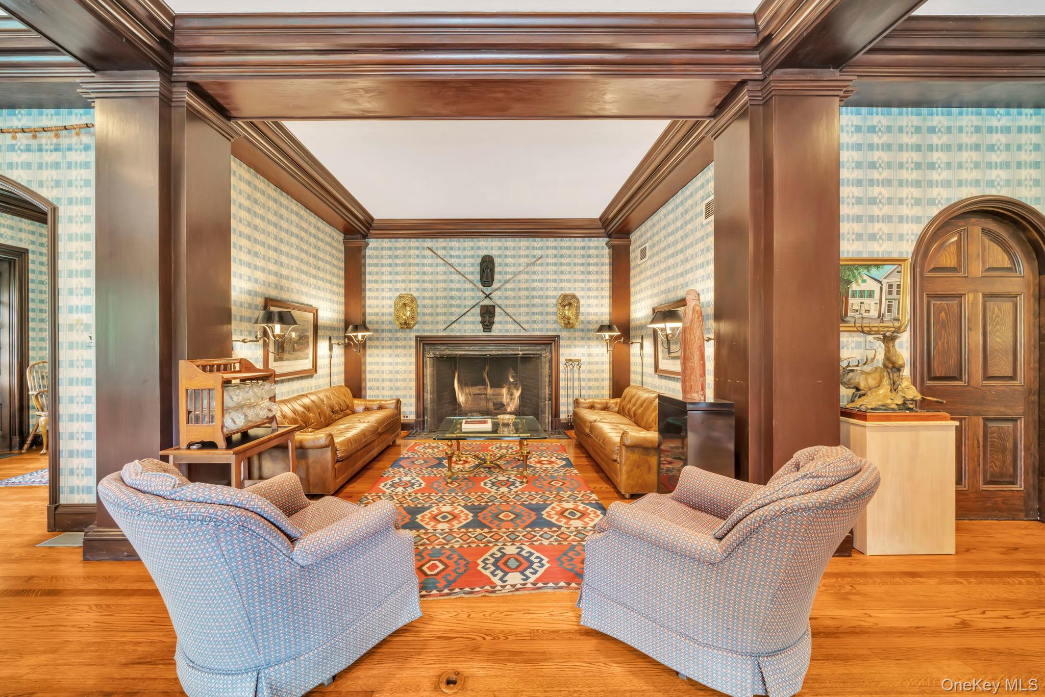 95 Piping Rock Road Locust Valley, NY 11560 - Photo 12 of 39 a living room with furniture and a fireplace