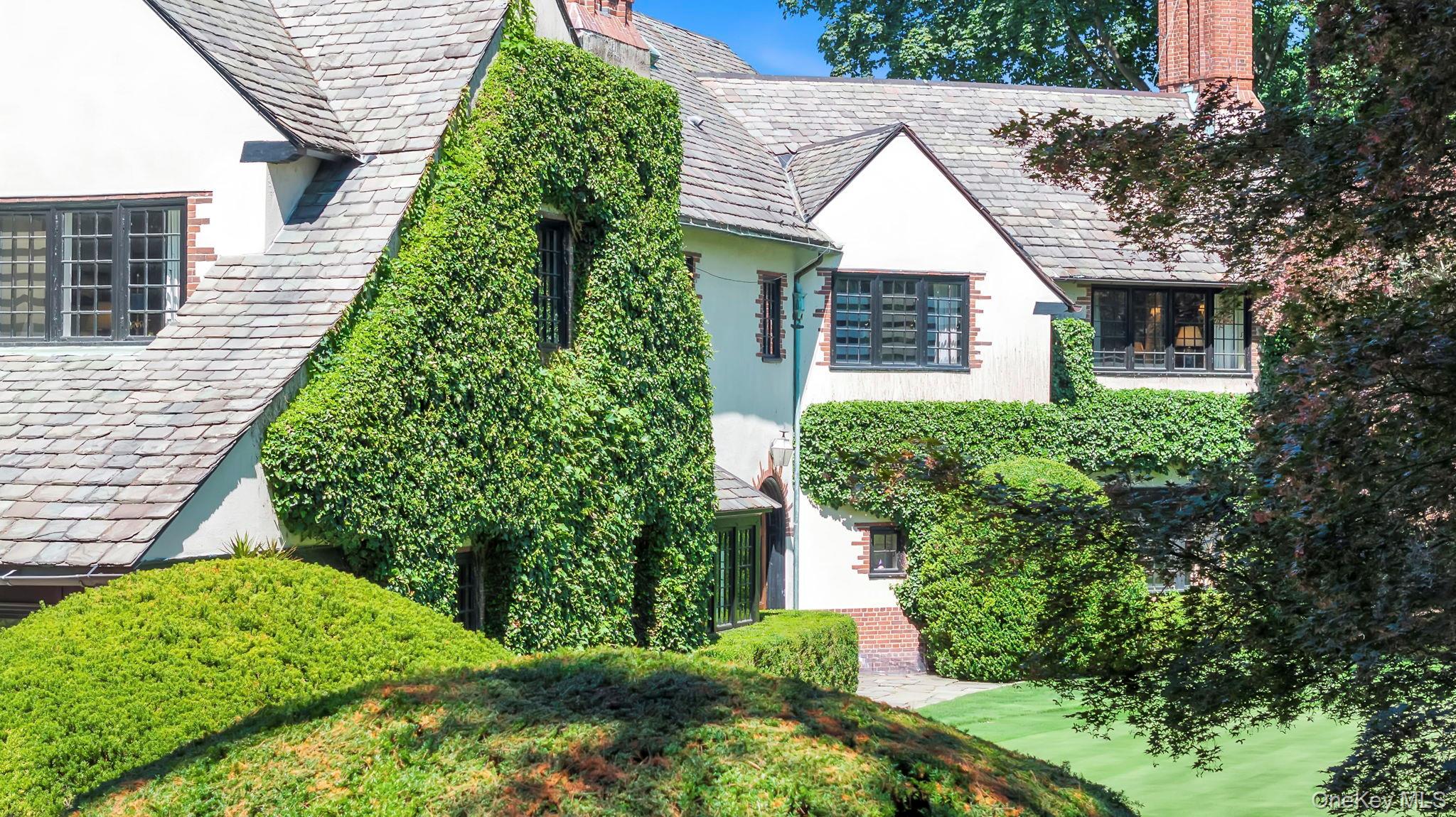 95 Piping Rock Road Locust Valley, NY 11560 - Photo 28 of 39 a aerial view of a house with a yard and plants