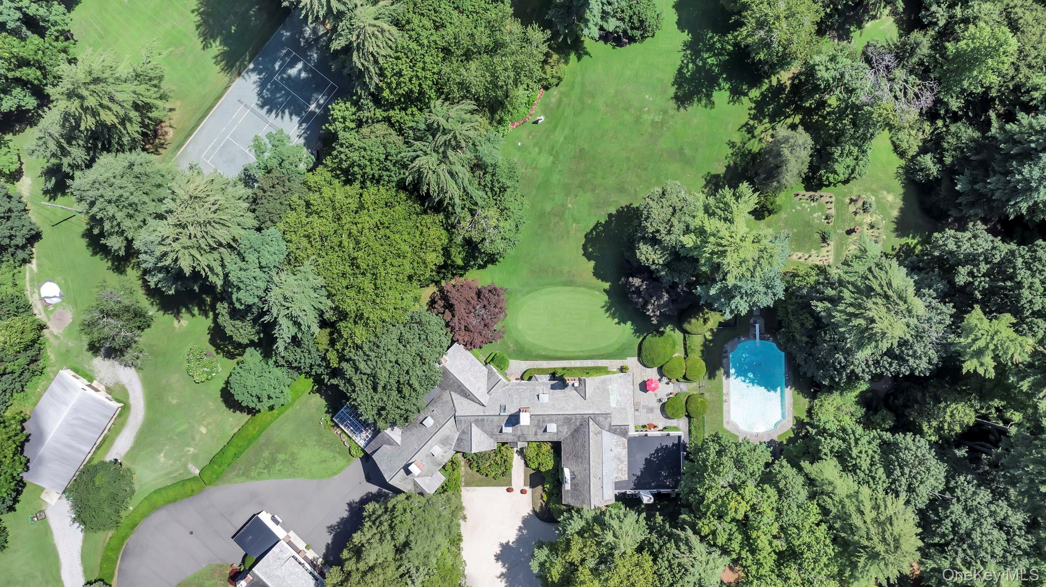 95 Piping Rock Road Locust Valley, NY 11560 - Photo 33 of 39 an aerial view of a house with a yard