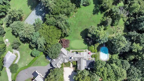 an aerial view of a house with a yard