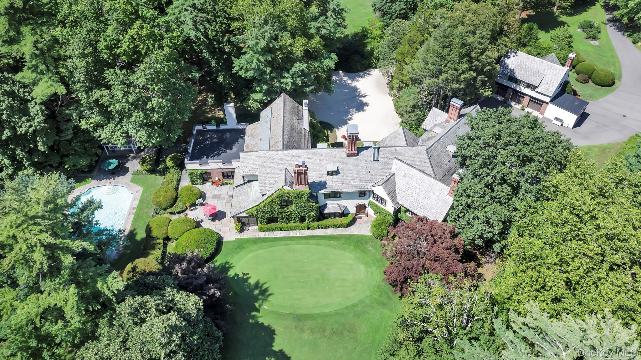 95 Piping Rock Road Locust Valley, NY 11560 - Photo 37 of 39 a view of house with garden