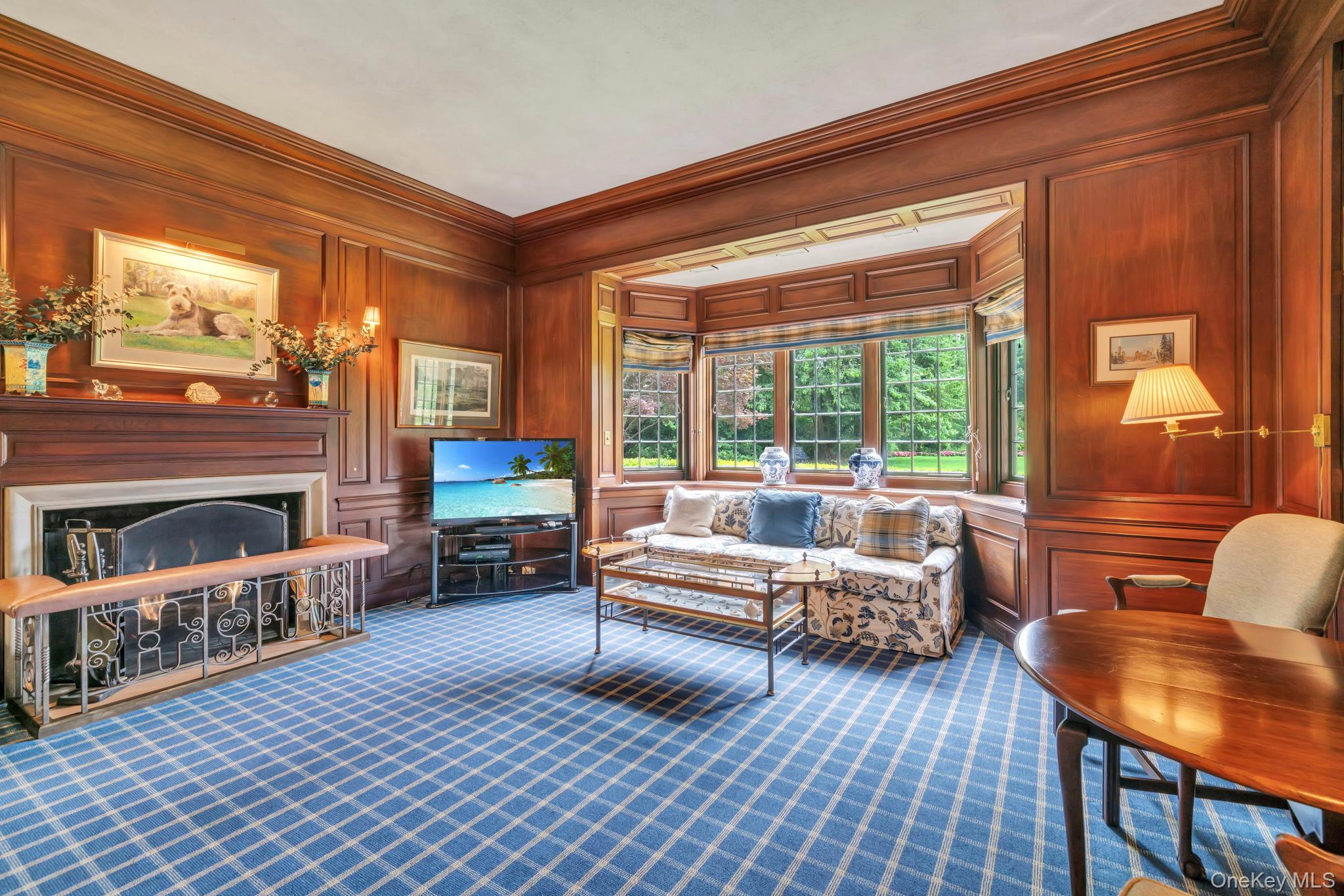 95 Piping Rock Road Locust Valley, NY 11560 - Photo 6 of 39 a living room with furniture and a fireplace