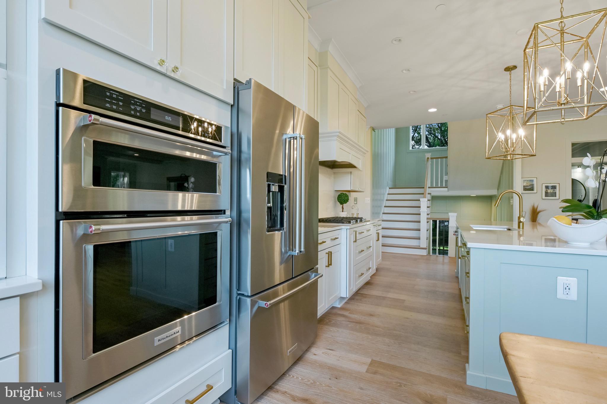 946 Benning Road Galesville, MD 20765 - Photo 9 of 59 a kitchen with granite countertop a refrigerator and a stove