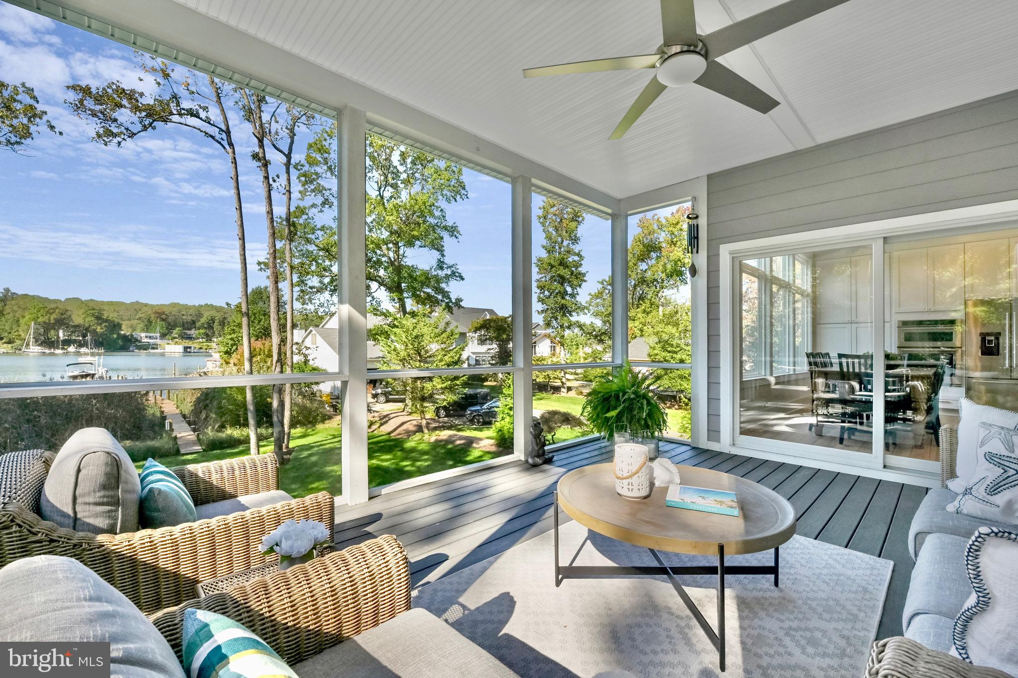 946 Benning Road Galesville, MD 20765 - Photo 12 of 57 a living room with furniture and a floor to ceiling window