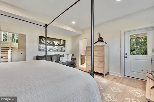 a spacious bathroom with a bathtub a sink and a window