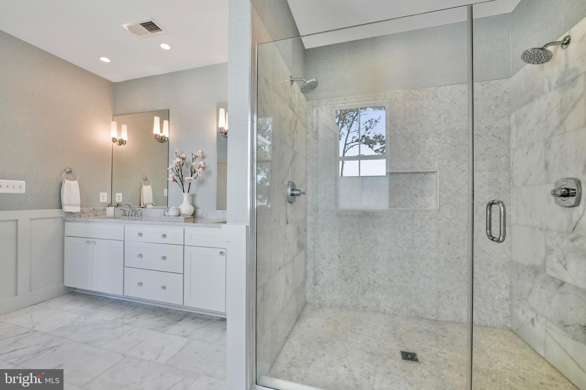 946 Benning Road Galesville, MD 20765 - Photo 28 of 59 a spacious bathroom with a shower sink and mirror