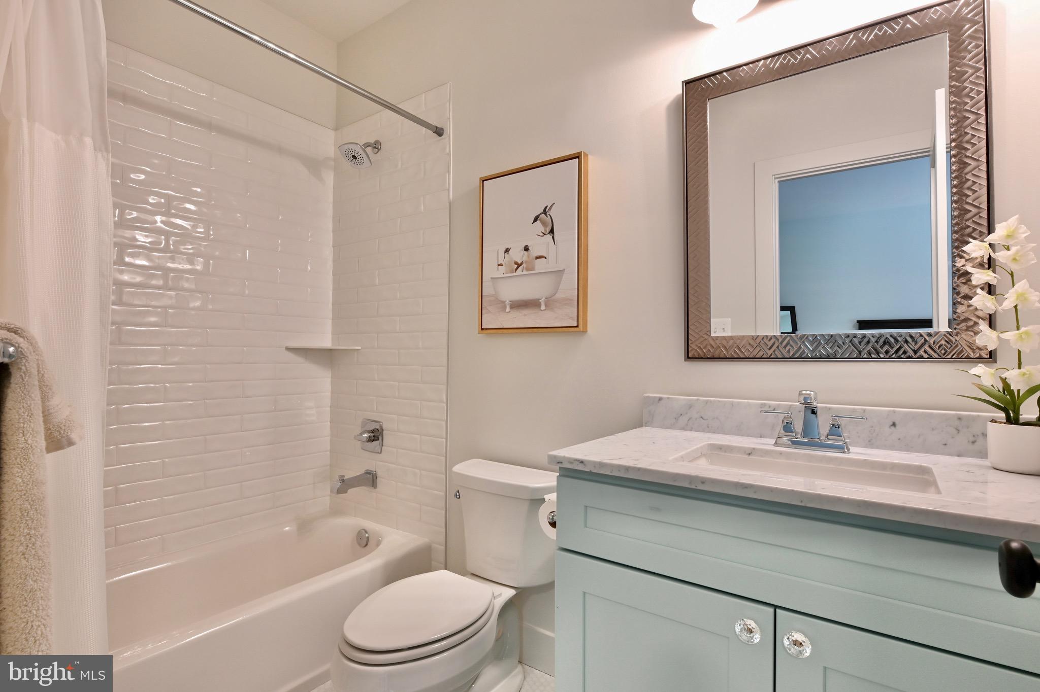 946 Benning Road Galesville, MD 20765 - Photo 32 of 57 a bathroom with a sink a toilet and shower