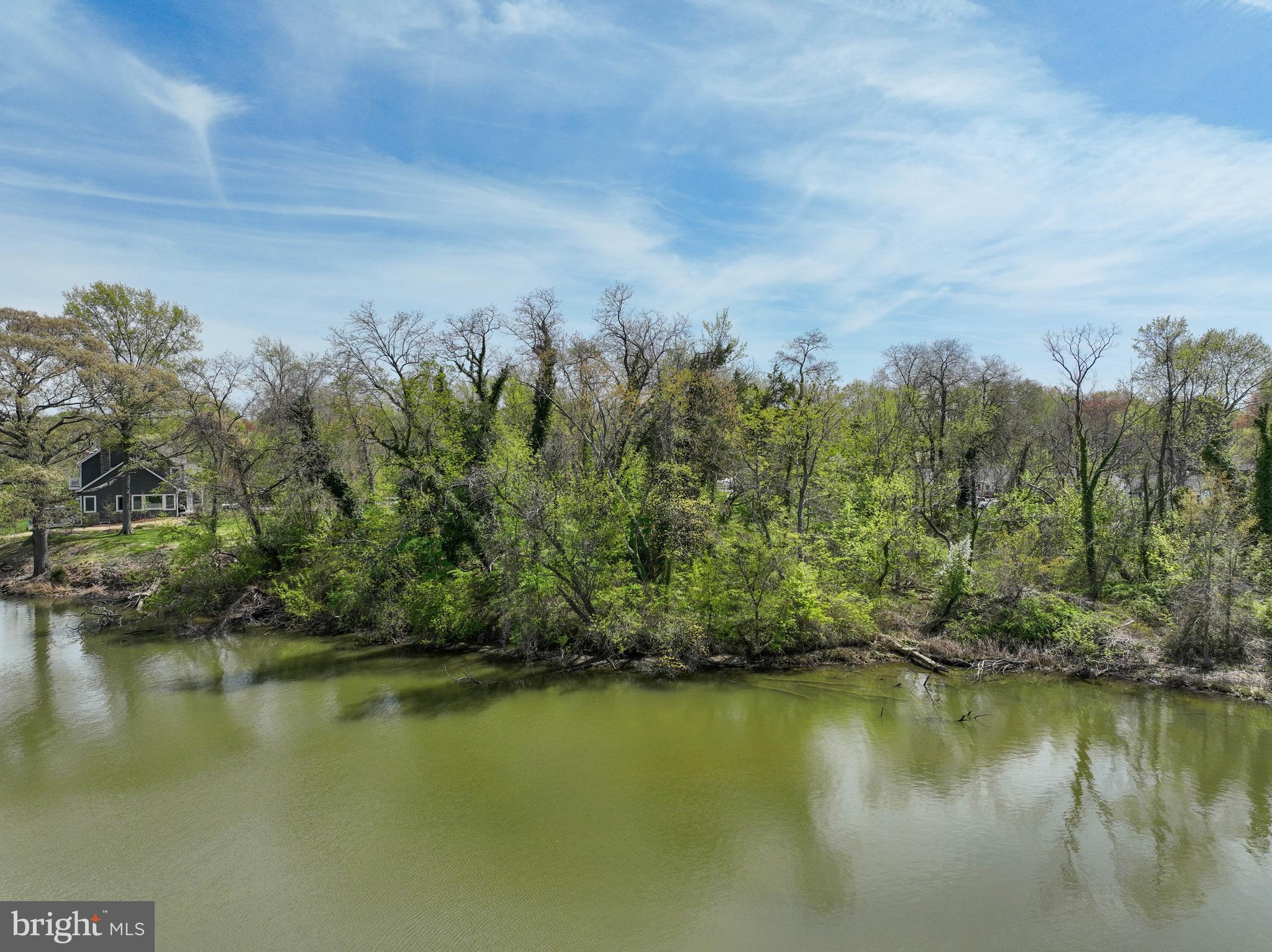 946 Benning Road Galesville, MD 20765 - Photo 40 of 59 a view of a lake with houses in the back