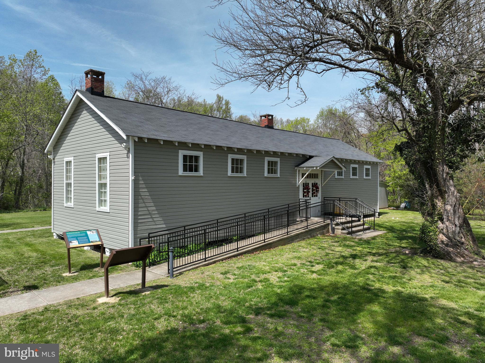 946 Benning Road Galesville, MD 20765 - Photo 49 of 59 a front view of a house with garden