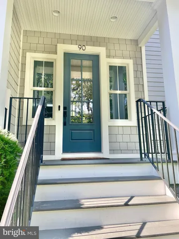 a kitchen with stainless steel appliances granite countertop a lot of counter space and a window