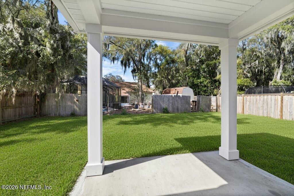 9019 Hipps Road Jacksonville, FL 32222 - Photo 4 of 35 a view of a back yard with a house and garden