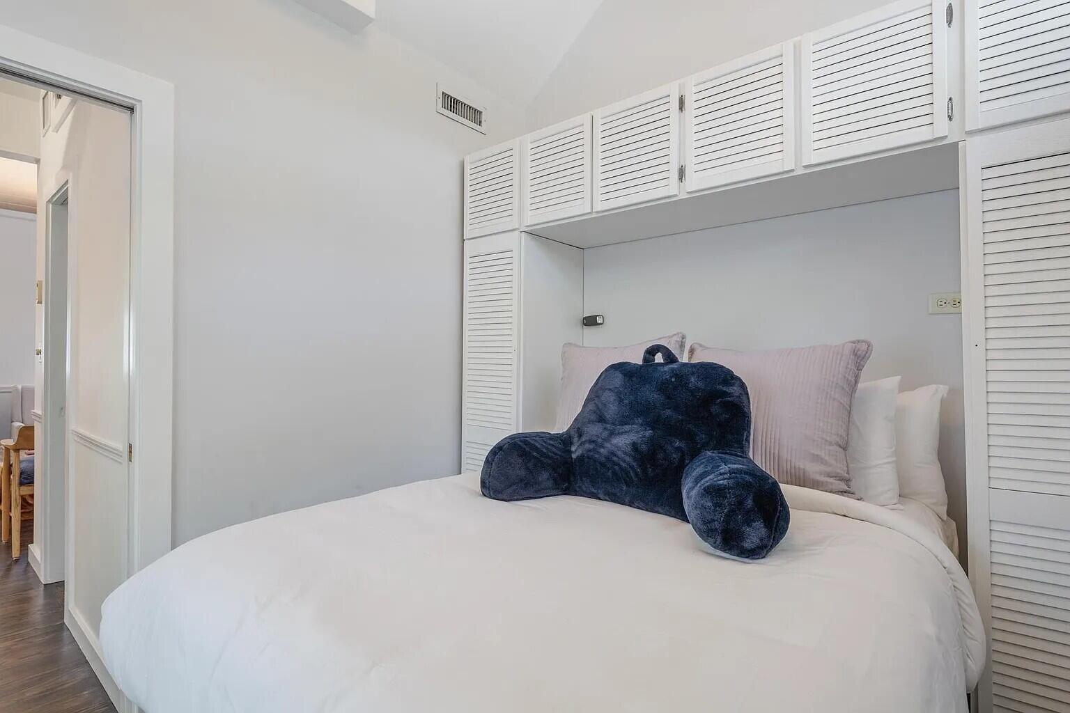 817 Terry Lane Key West, FL 33040 - Photo 14 of 20 a bed sitting in a bedroom next to a window