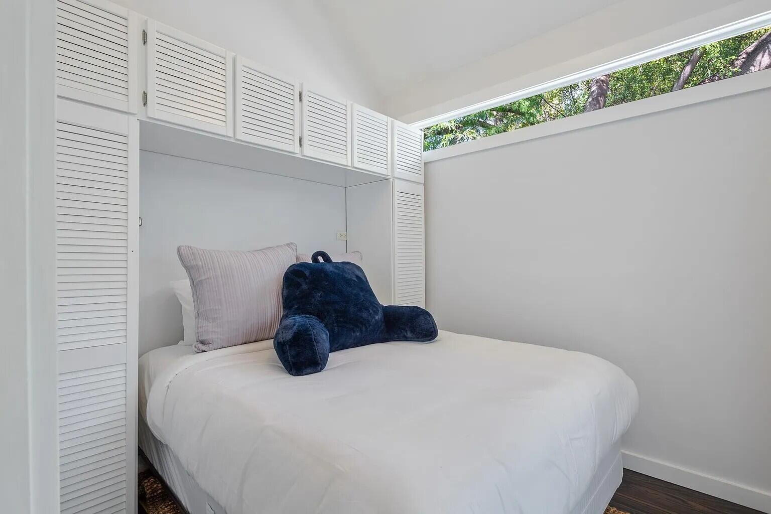 817 Terry Lane Key West, FL 33040 - Photo 15 of 20 a bed sitting in a bedroom next to a window