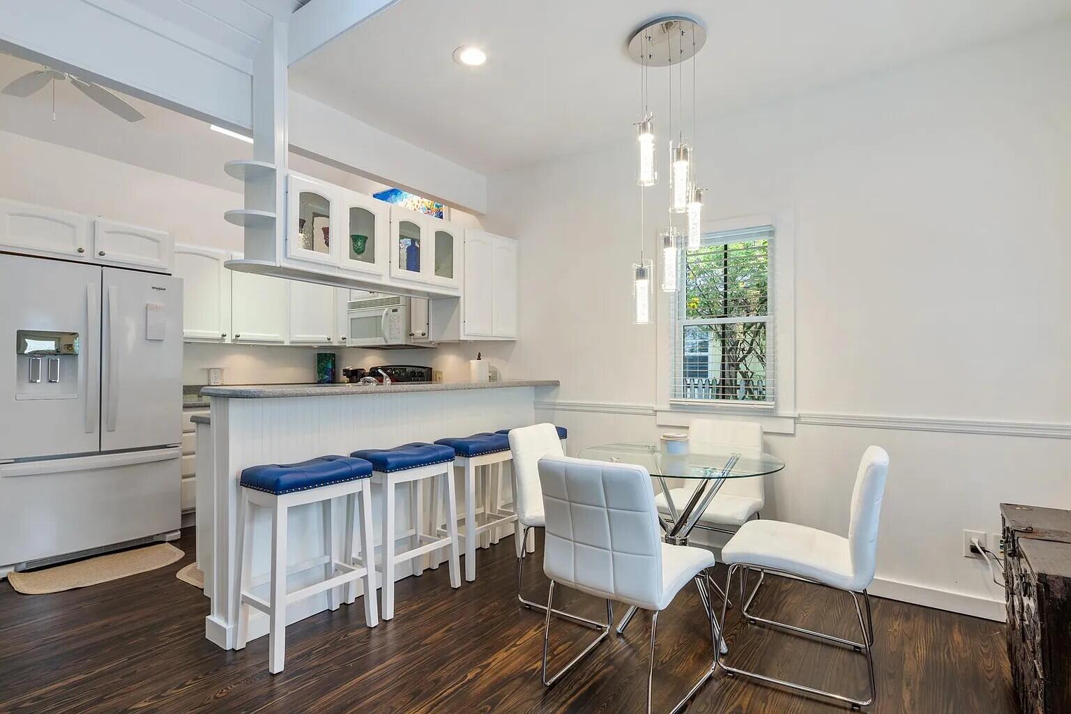 817 Terry Lane Key West, FL 33040 - Photo 5 of 20 a view of kitchen with cabinets and wooden floor