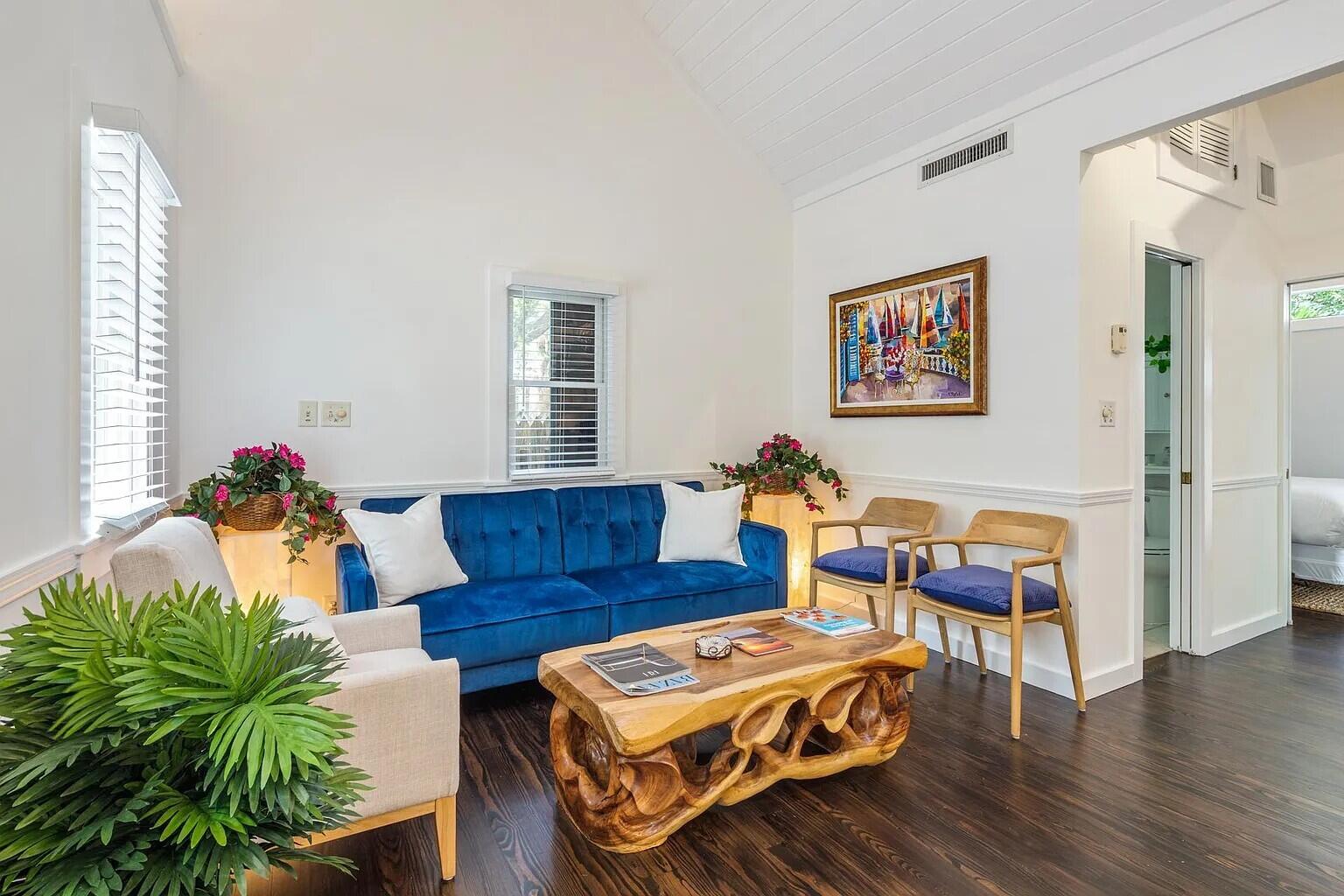 817 Terry Lane Key West, FL 33040 - Photo 6 of 20 a living room with furniture stairs and a potted plant