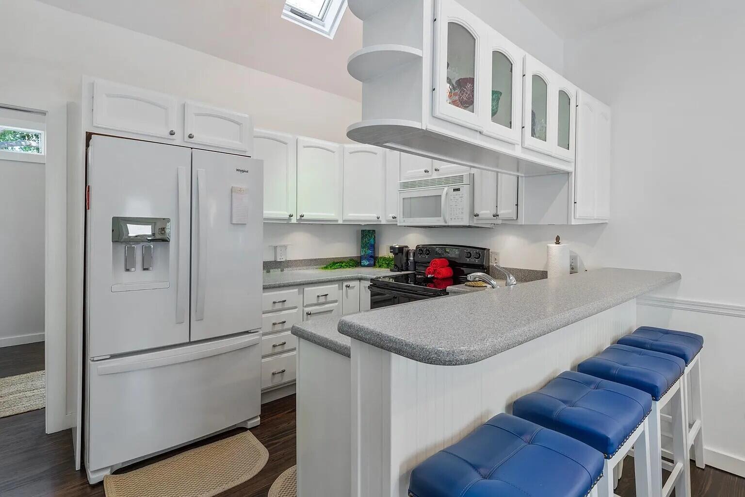 817 Terry Lane Key West, FL 33040 - Photo 8 of 20 a kitchen with cabinets and stainless steel appliances
