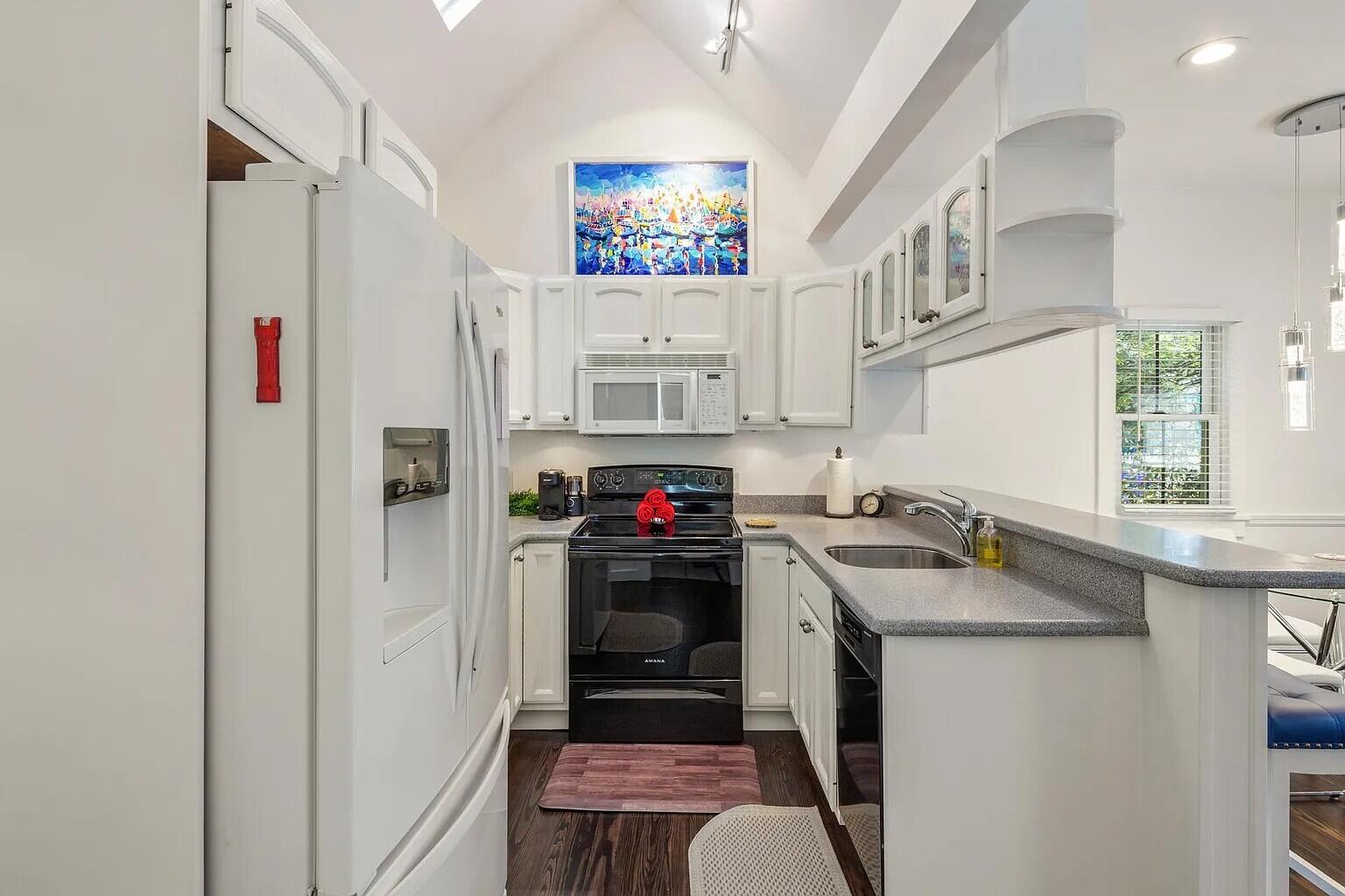 817 Terry Lane Key West, FL 33040 - Photo 10 of 20 a kitchen with stainless steel appliances granite countertop a refrigerator and a stove