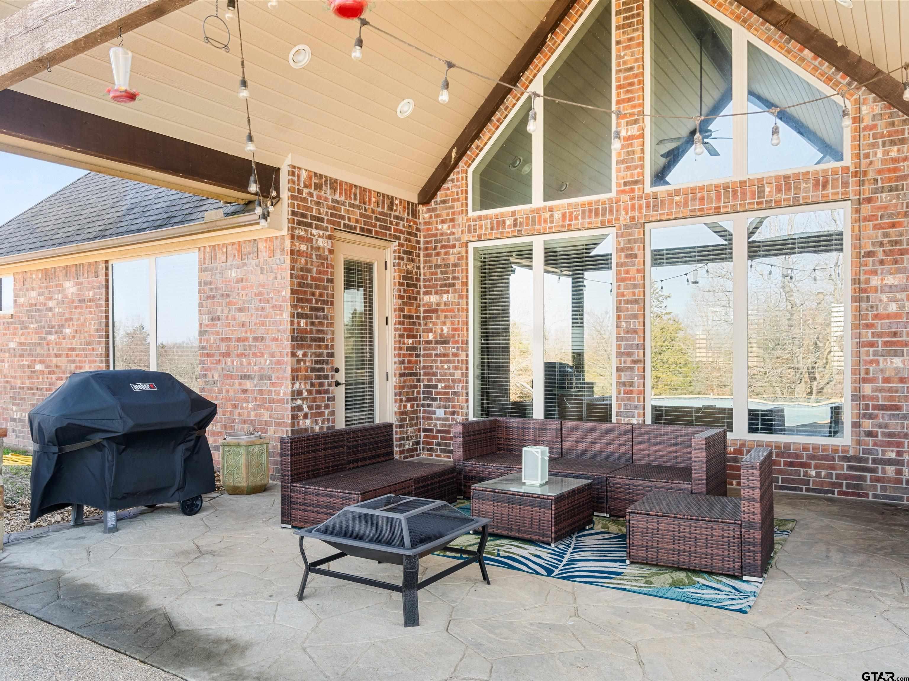 11087 Wolverine Road Pittsburg, TX 75686 - Photo 23 of 39 a living room with furniture and large windows