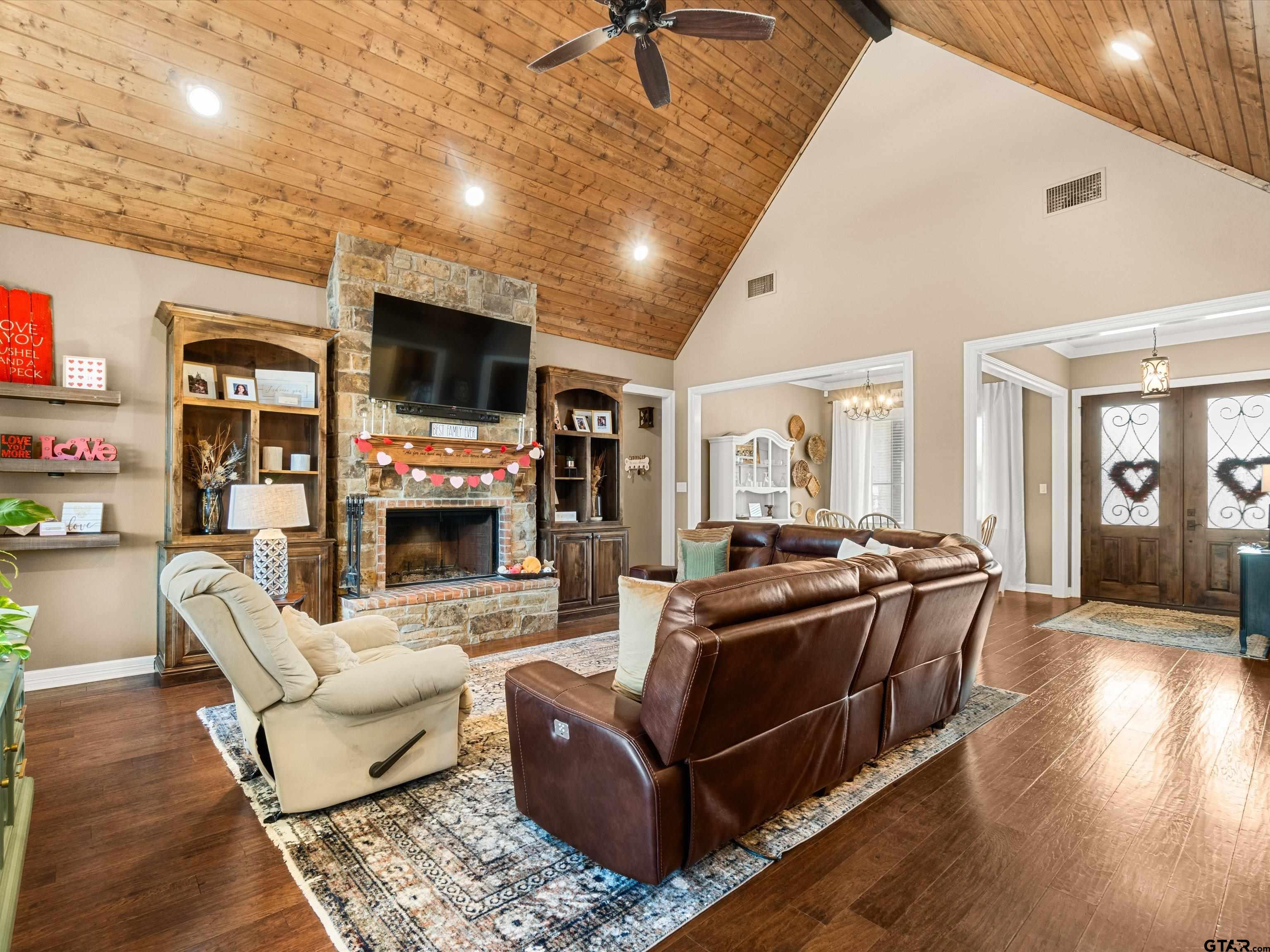 11087 Wolverine Road Pittsburg, TX 75686 - Photo 10 of 39 a living room with fireplace furniture and a flat screen tv