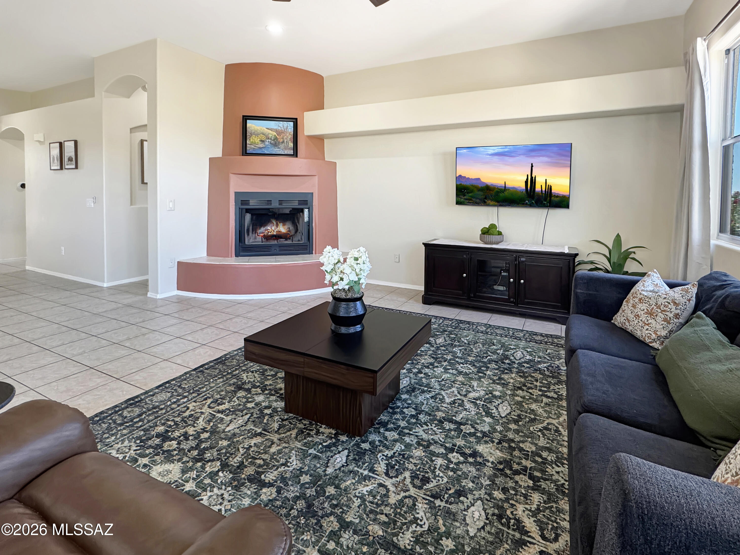 10835 South Heart Break Ridge Place Vail, AZ 85641 - Photo 19 of 49 a living room with furniture and a fireplace