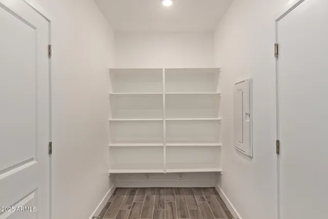 a bathroom with a toilet a sink and a mirror