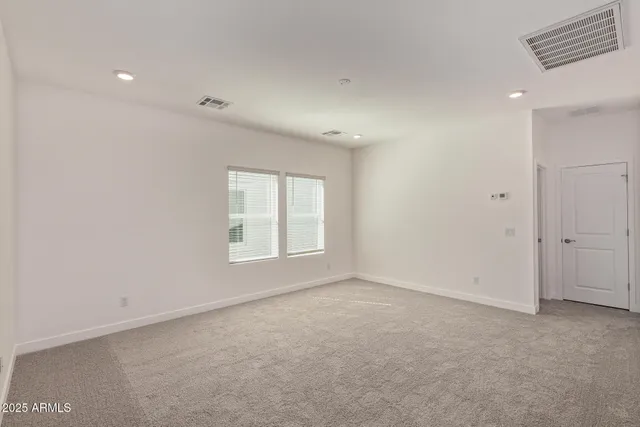 an empty room with white walls