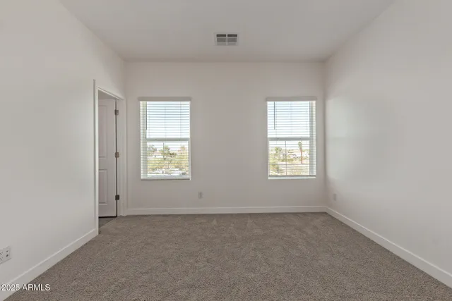a spacious bathroom with a shower sink and mirror