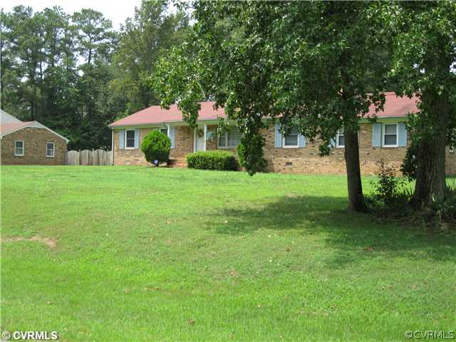 11300 Celtic Road Chesterfield, VA 23838 - Photo 3 of 12 a front view of a house with garden
