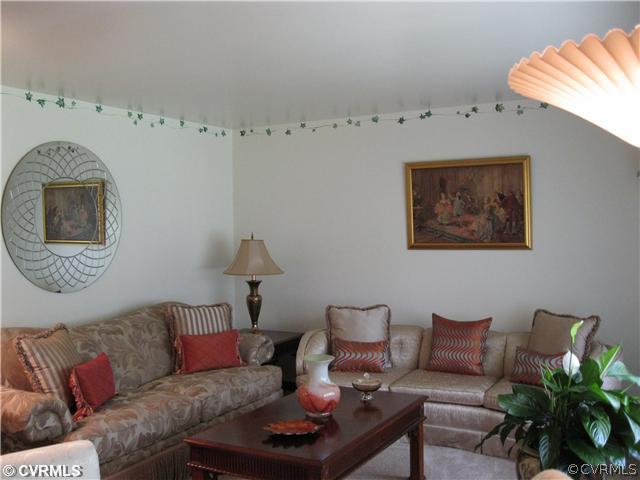 11300 Celtic Road Chesterfield, VA 23838 - Photo 6 of 12 a living room with furniture and a mirror