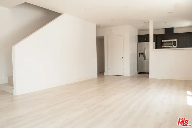 a view of a kitchen with a refrigerator