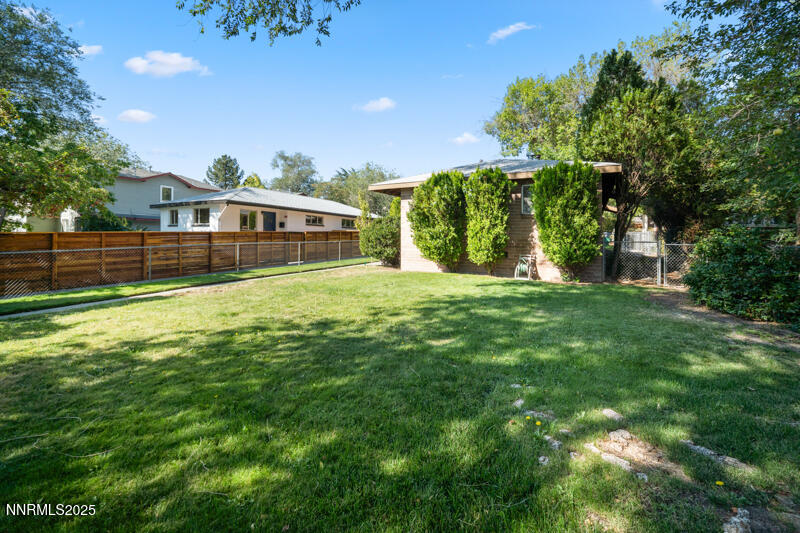 1245 Plumas Street Reno, NV 89509 - Photo 2 of 16 a front view of a house with a big yard